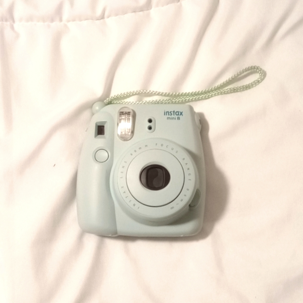 Instax mini 8 camera w/ case + two packets of film (opened but never used).